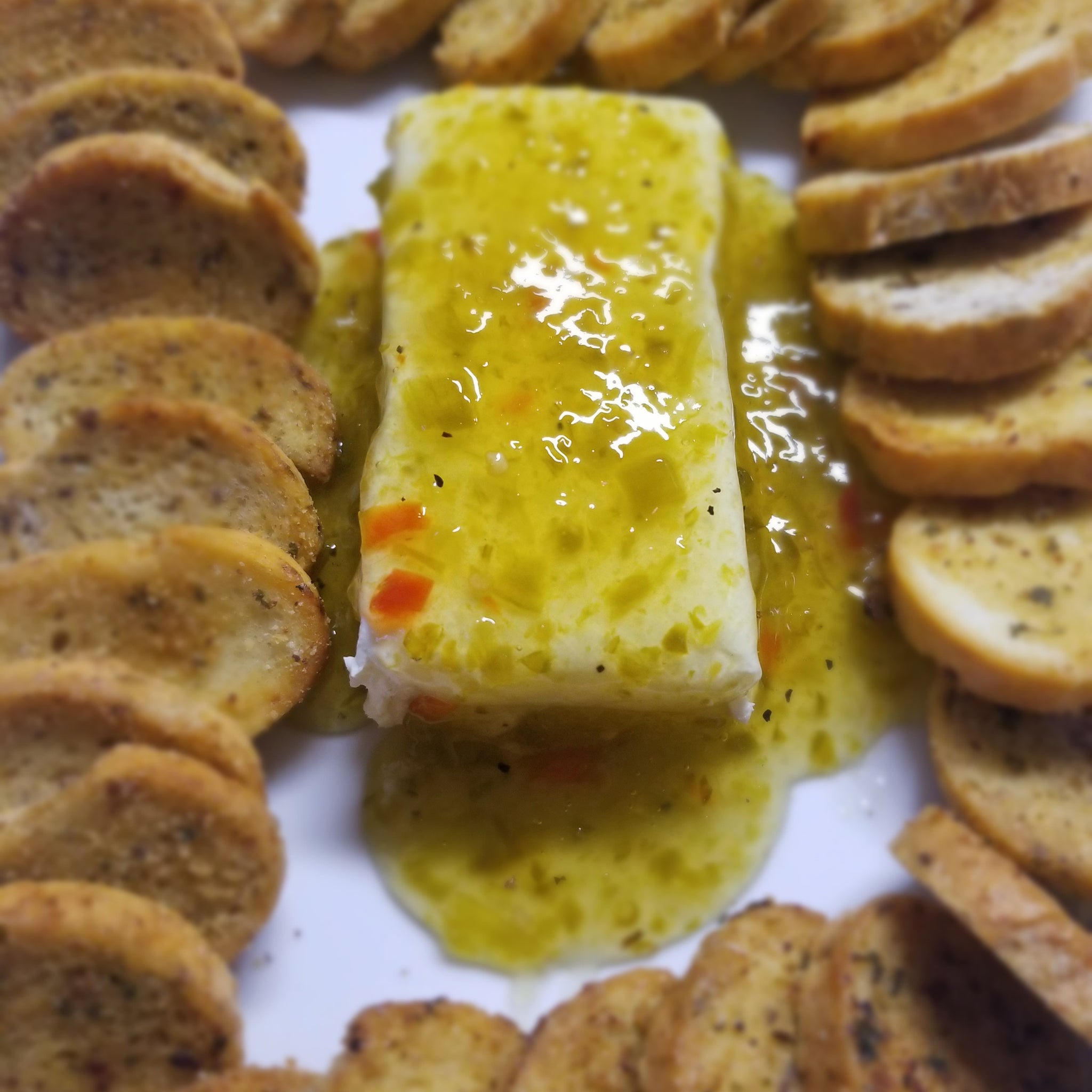 Cream cheese and green chili jam appetizer, served with toasted baguettes. It's a quick, easy appetizer everyone will love. Pepper jam and cream cheese appetizer