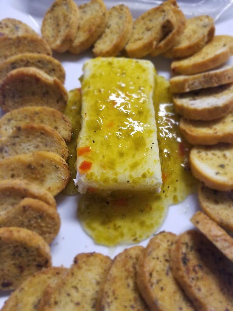 Cream cheese and green chili jam appetizer, served with toasted baguettes. It's a quick, easy appetizer everyone will love. Pepper jam and cream cheese appetizer